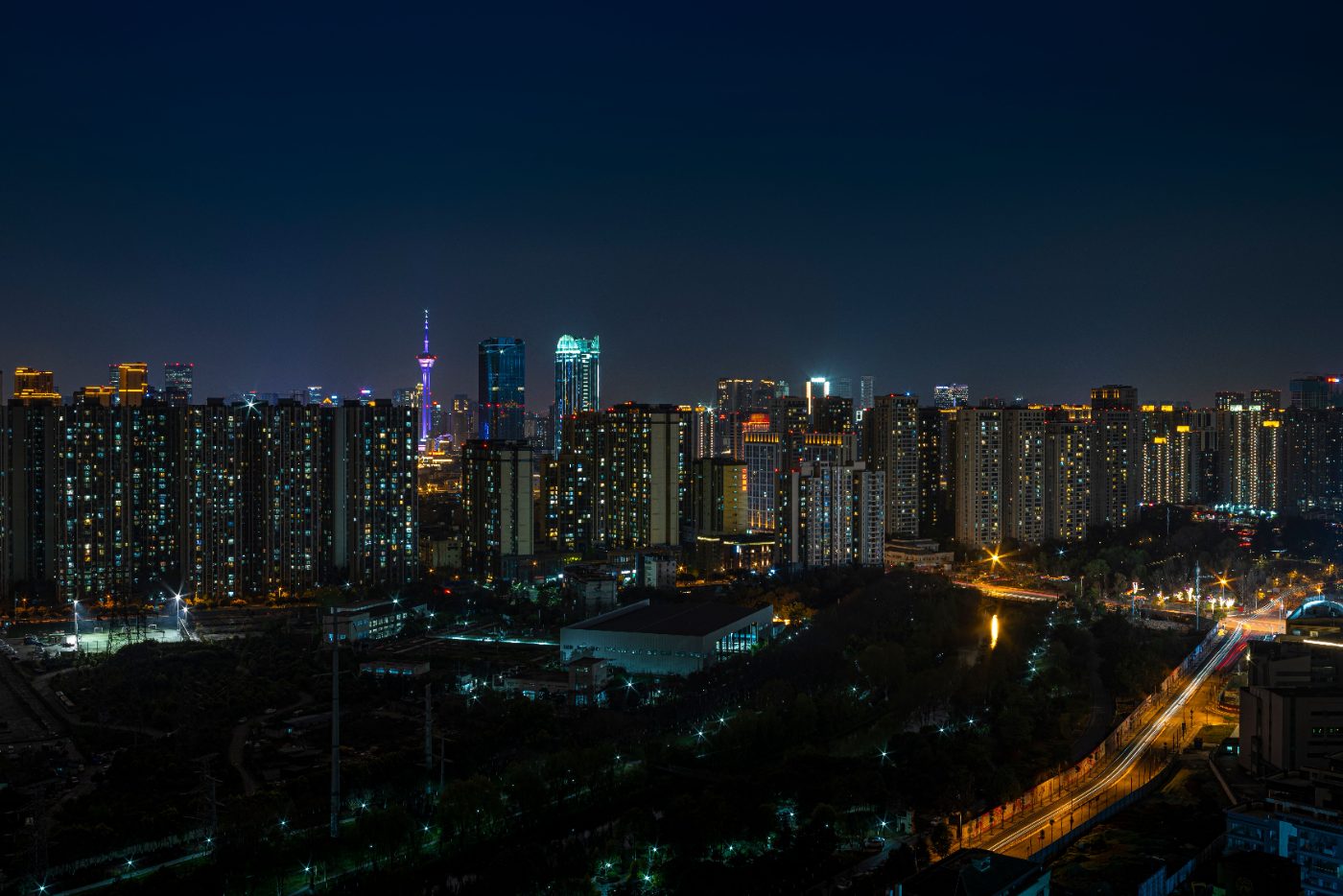 Explore the vibrant Chengdu skyline at night showcasing urban architecture and city lights.
