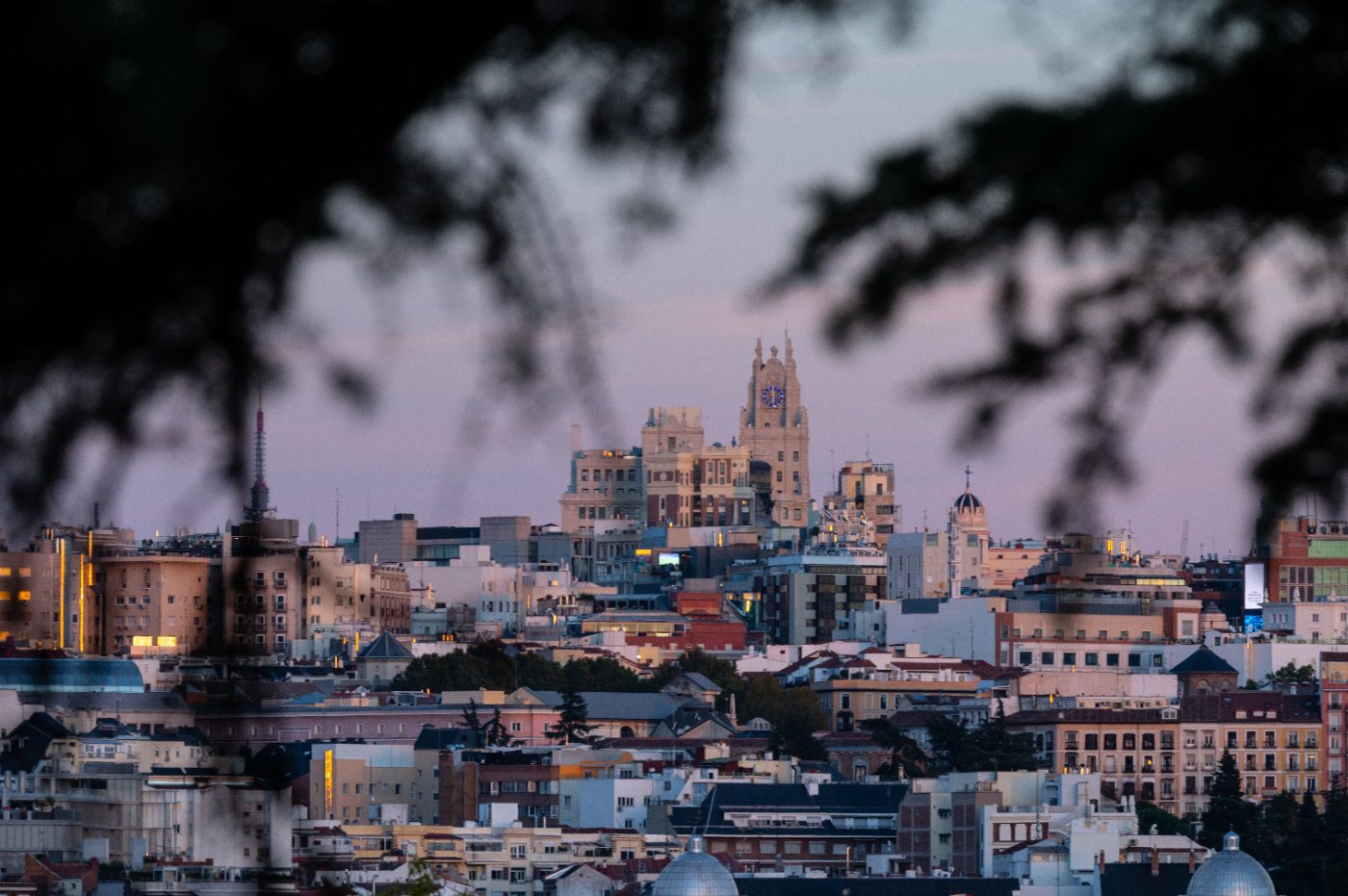 Beautiful cityscape of Madrid, Spain, captured during twilight with iconic landmarks visible.