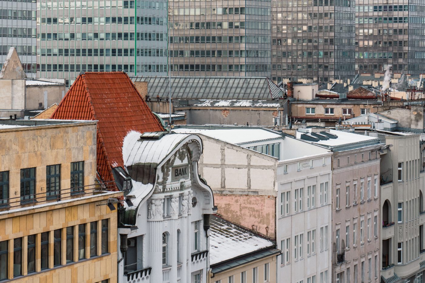 Aerial view of Poznań's historic and modern architecture during winter.