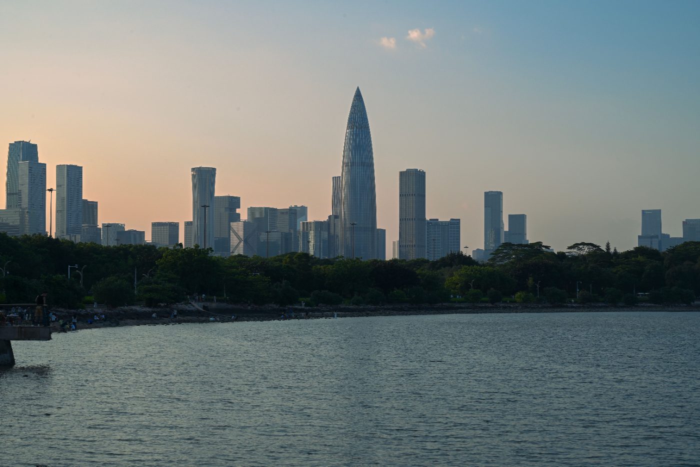 Scenic view of Shenzhen skyline during sunset with waterfront.